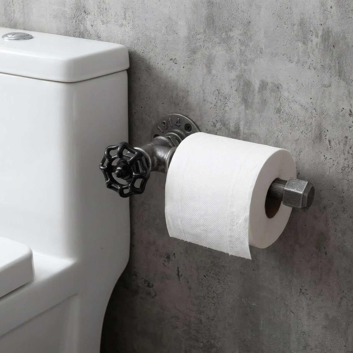 Wandmontierter Toilettenpapierhalter aus schwarzem Temperguss mit Handrad, neben dem WC montiert