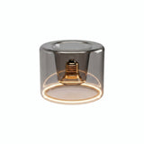 LED-Donut-Lampe E27 aus Rauchglas, Ø 120 mm, eingeschaltet, warmer Lichtring, weißer Hintergrund