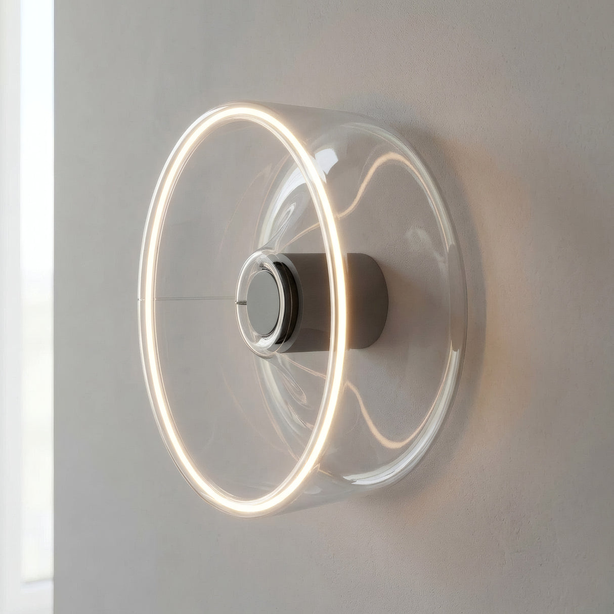 LED-Donut-Lampe E27 aus klarem Glas, Ø 195 mm, als Wandleuchte mit warmem Lichtschein